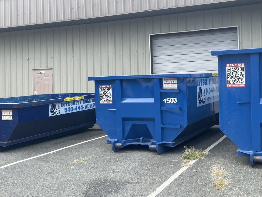 Integrity Roll Off dumpsters lined up at the Fredericksburg shop