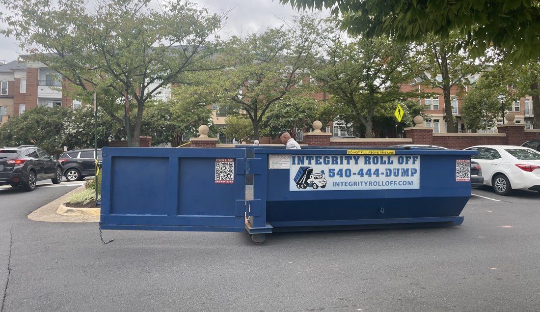 Low-walled 10 yard Integrity Roll Off dumpster set at the curb
